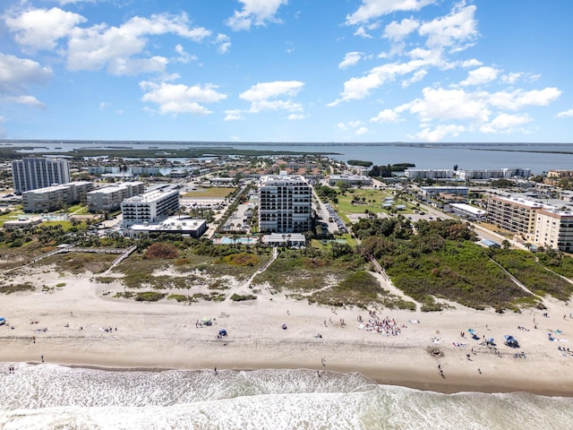 aerial view with a beach view and a water view