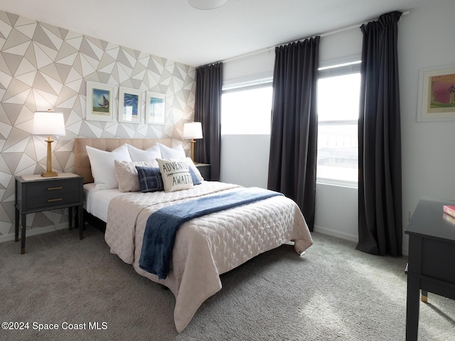 bedroom with carpet flooring and multiple windows