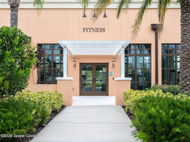 8933 Amelia Downs Trl, Kissimmee, FL 34747 - doorway to property featuring french doors and stucco siding