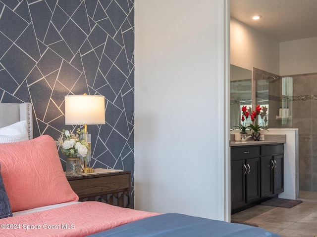 8933 Amelia Downs Trl, Kissimmee, FL 34747 - bedroom with tile patterned floors, ensuite bath, and recessed lighting
