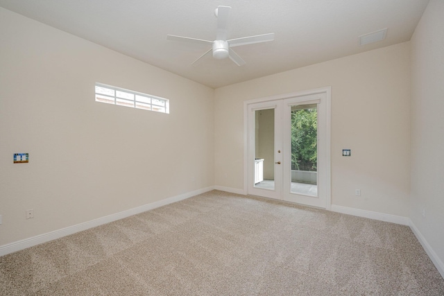 spare room with french doors, carpet, and a healthy amount of sunlight