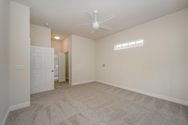 empty room with light carpet and ceiling fan