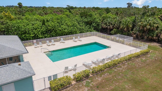 view of swimming pool featuring a patio