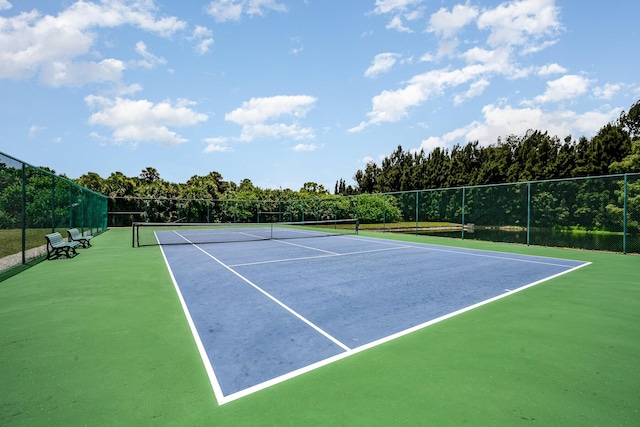 view of sport court with basketball hoop