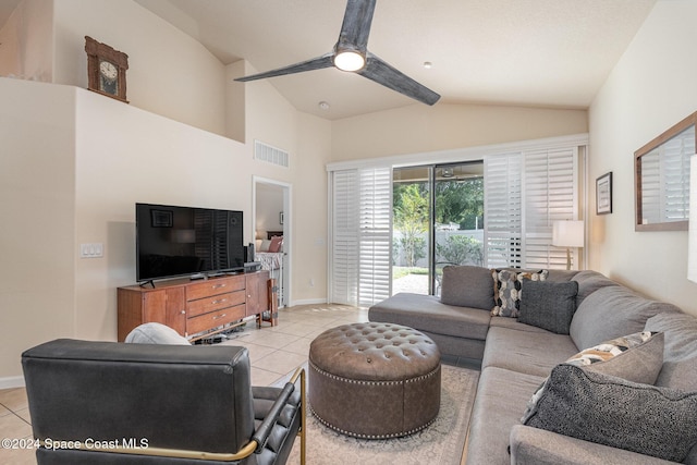 living room featuring vaulted ceiling with beams and light tile patterned flooring