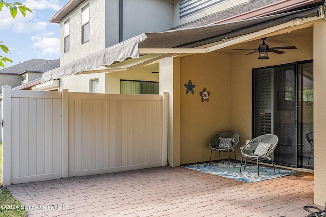 view of patio featuring ceiling fan