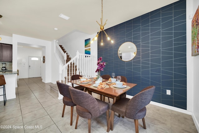 tiled dining room featuring tile walls