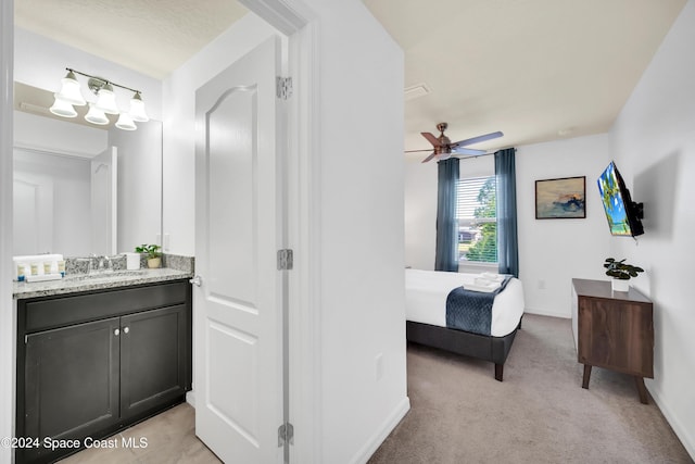 bathroom featuring ceiling fan and vanity