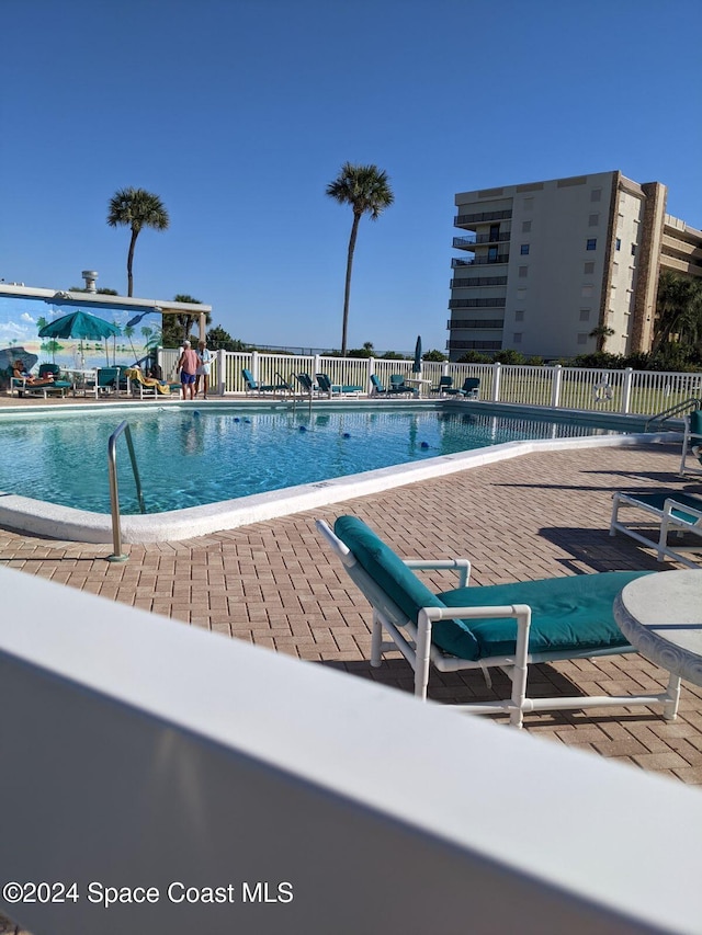 view of pool featuring a patio area