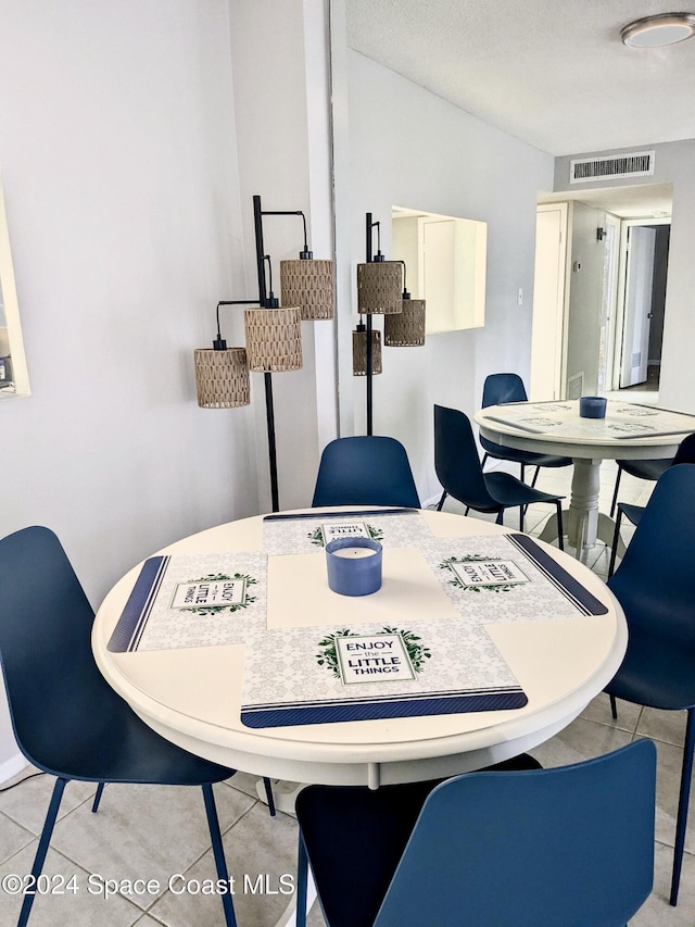 dining room featuring light tile patterned floors