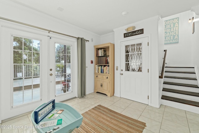 entryway featuring light tile patterned floors and ornamental molding