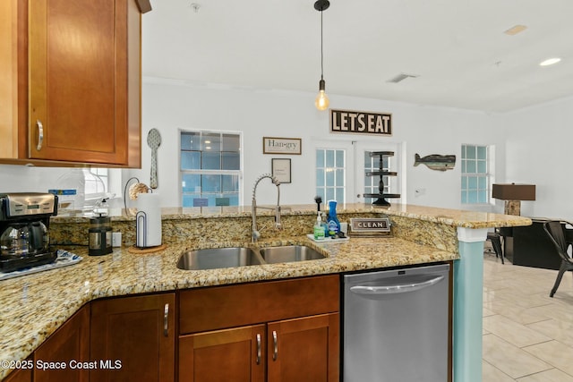 kitchen with kitchen peninsula, light stone counters, sink, and stainless steel dishwasher