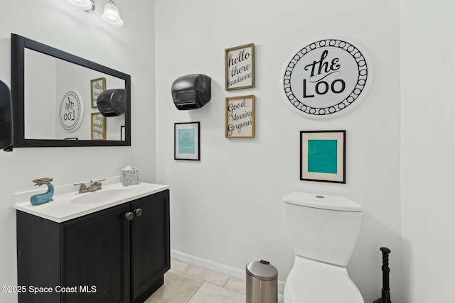 bathroom with tile patterned floors, vanity, and toilet