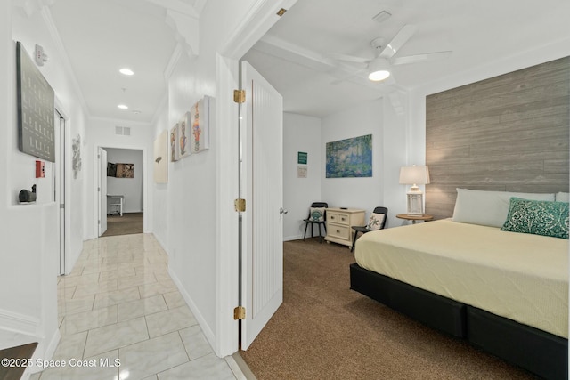 bedroom featuring wood walls, light carpet, crown molding, ceiling fan, and beam ceiling