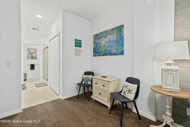 sitting room featuring tile patterned flooring