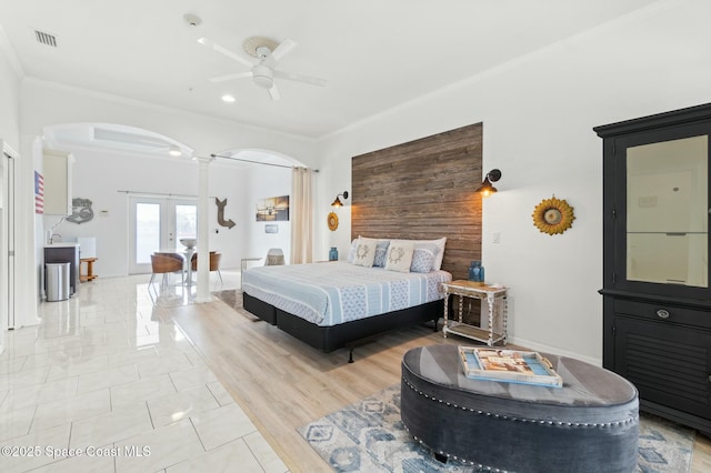 bedroom featuring french doors, ceiling fan, and crown molding