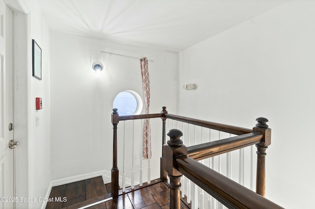 hall with dark hardwood / wood-style flooring