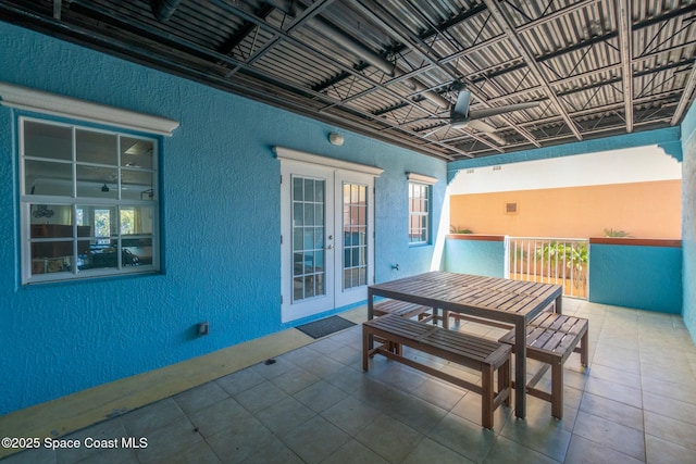 view of patio with ceiling fan and french doors