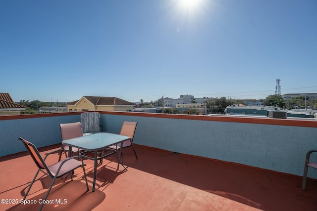 view of patio featuring a balcony