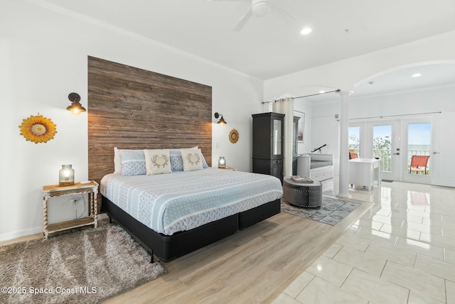 bedroom with ceiling fan, light tile patterned floors, crown molding, and access to outside