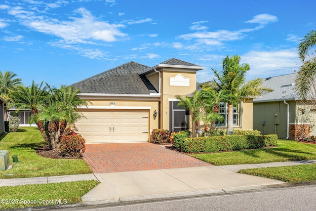 view of front of house with a front lawn and a garage