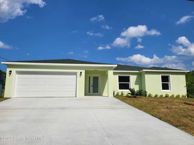 ranch-style home with a garage