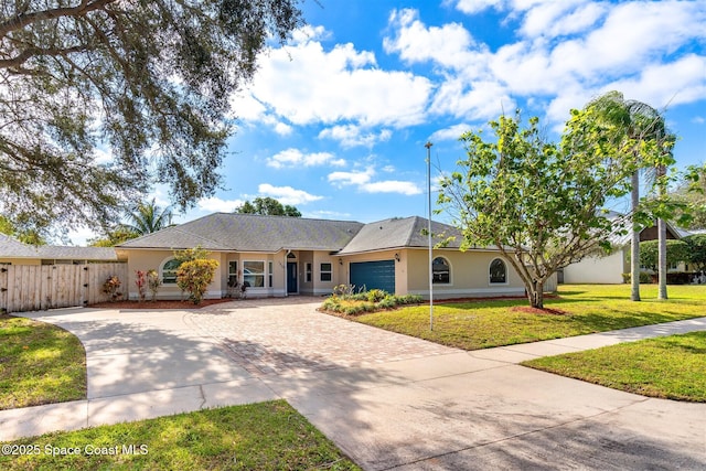 ranch-style home featuring a front yard and a garage