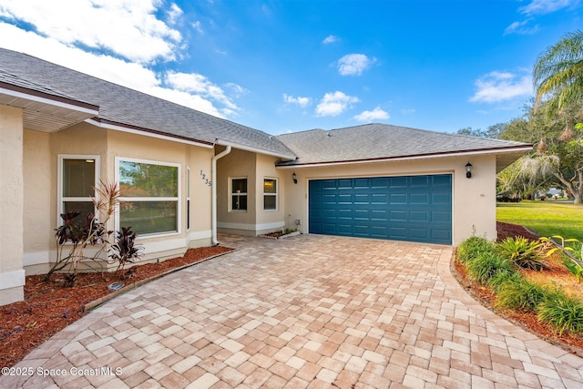 ranch-style home with a garage