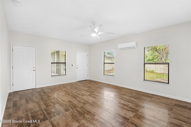 unfurnished room featuring ceiling fan and an AC wall unit