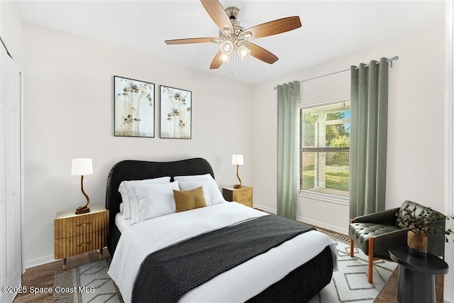 bedroom with ceiling fan and light hardwood / wood-style floors