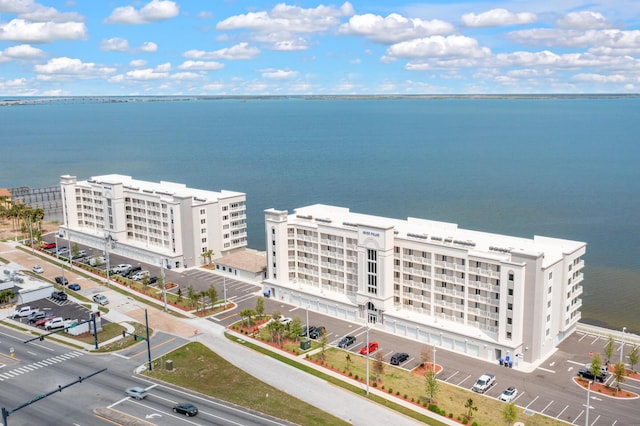 birds eye view of property with a water view