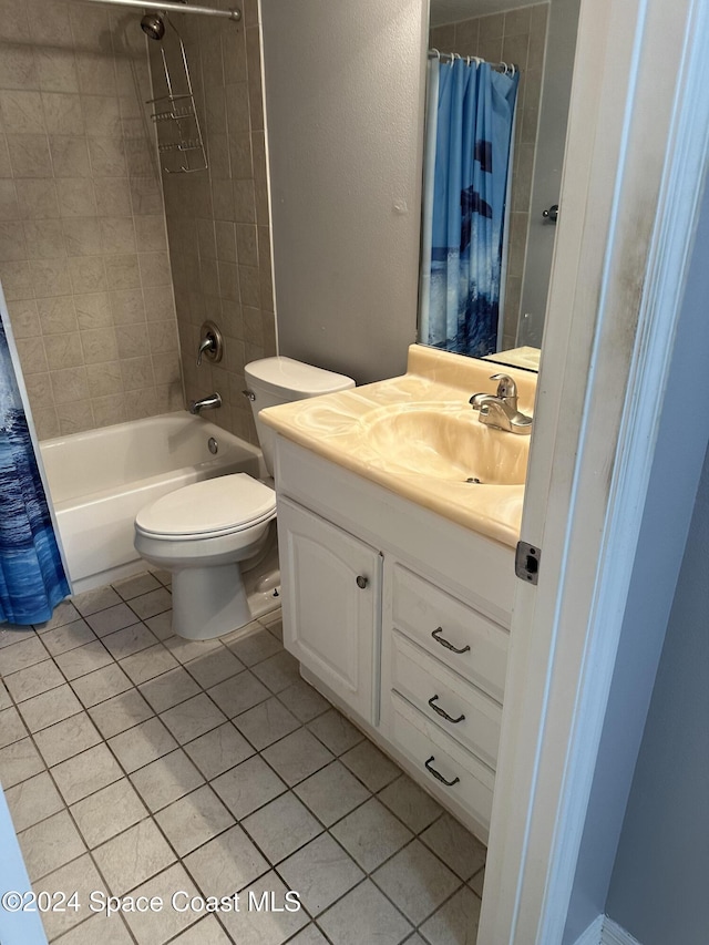 full bathroom featuring tile patterned floors, vanity, toilet, and shower / tub combo