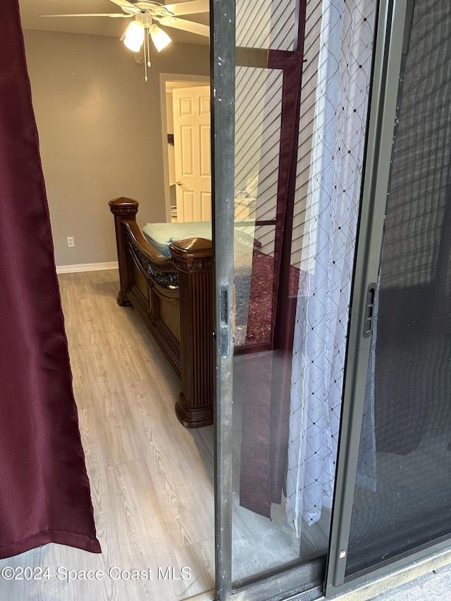 bathroom featuring hardwood / wood-style floors and ceiling fan