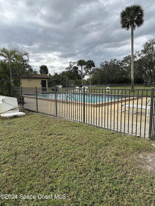 view of yard featuring a community pool