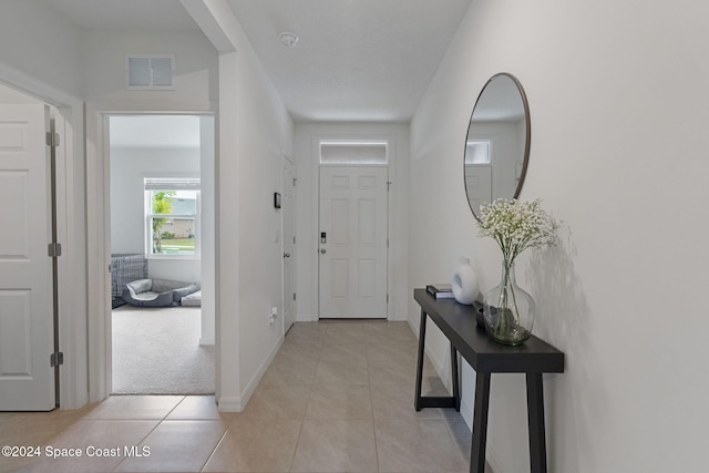 interior space with light tile patterned floors