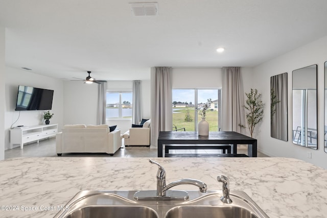 kitchen with ceiling fan and sink