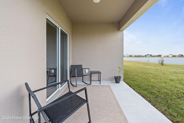 view of patio featuring a water view