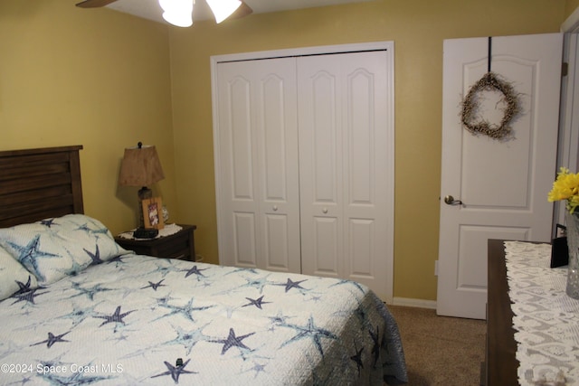 carpeted bedroom with a closet and ceiling fan