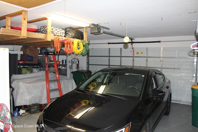 garage featuring a garage door opener