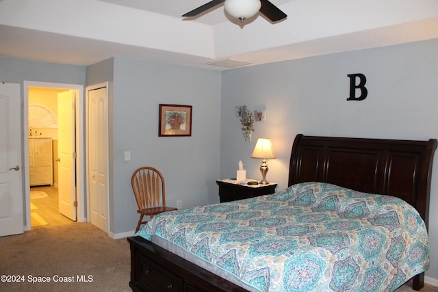 bedroom featuring ceiling fan, light colored carpet, and a closet