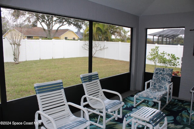 sunroom / solarium with lofted ceiling