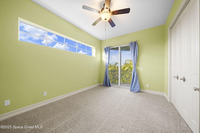 empty room featuring carpet and ceiling fan