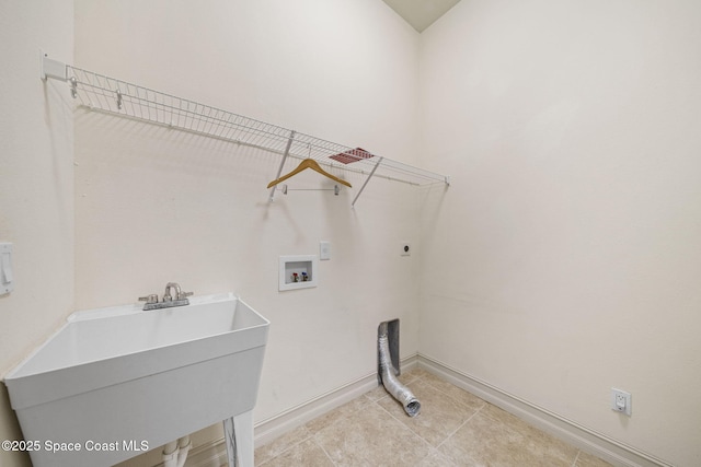 laundry area featuring hookup for an electric dryer, hookup for a washing machine, and sink