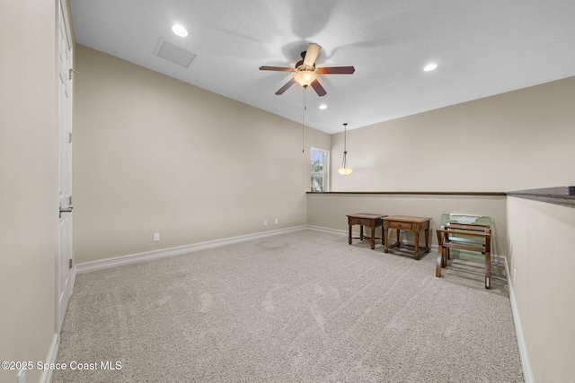 carpeted empty room with ceiling fan