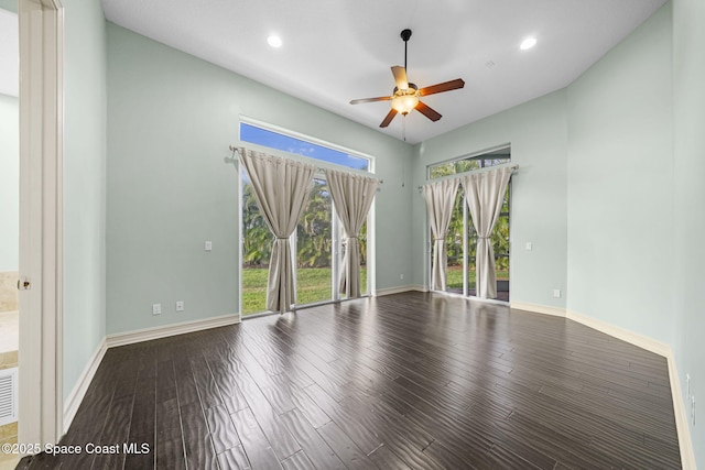 empty room with ceiling fan and wood-type flooring