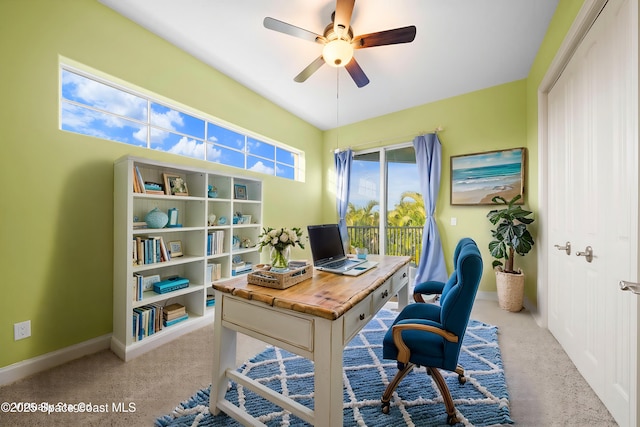 carpeted home office with ceiling fan