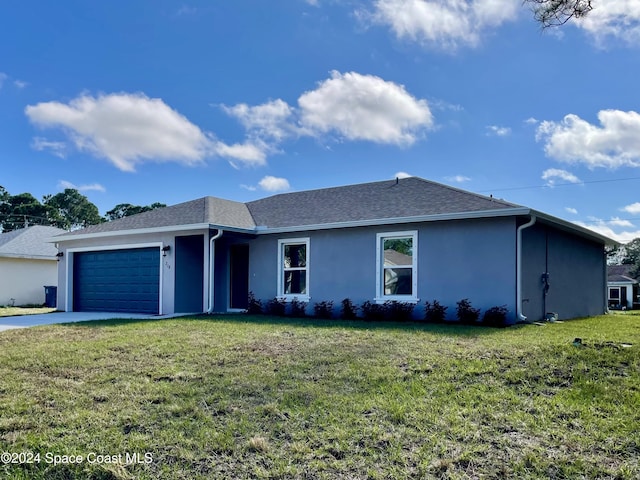 single story home featuring a garage and a front lawn