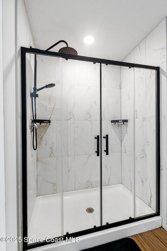 bathroom featuring an enclosed shower