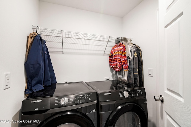 laundry room featuring separate washer and dryer