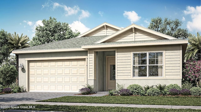 view of front facade with a front yard and a garage